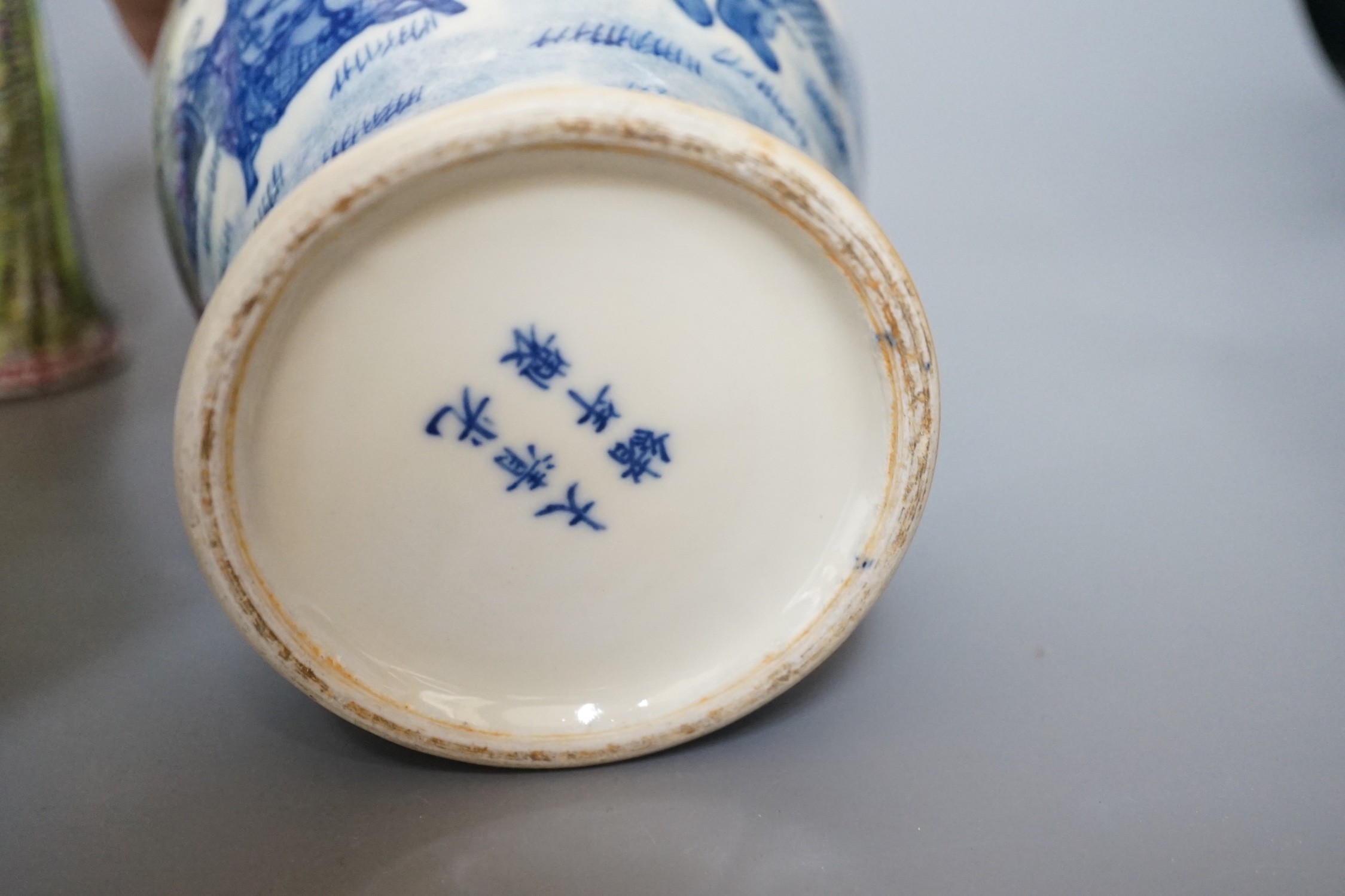 A Chinese blue and white figural vase and two polychrome figures, tallest 24cm